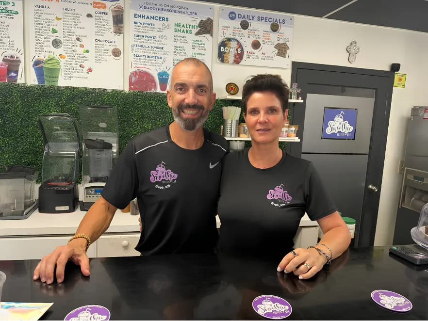The owners of Smoothie Protein Bar behind the counter